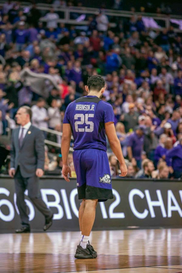 TCU point guard Alex Robinson and TCU head coach Jamie Dixon walk off the court following their 70-61 defeat at the hands of Kansas State in the Big 12 Tournament. Photo by Cristian ArguetaSoto.