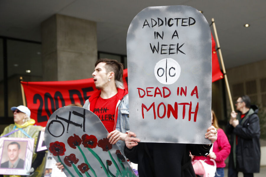 Protesters demonstrate against the FDAs opioid prescription drug approval practices, Friday, April 5, 2019, in front of the Department of Health and Human Services headquarters in Washington. (AP Photo/Patrick Semansky)