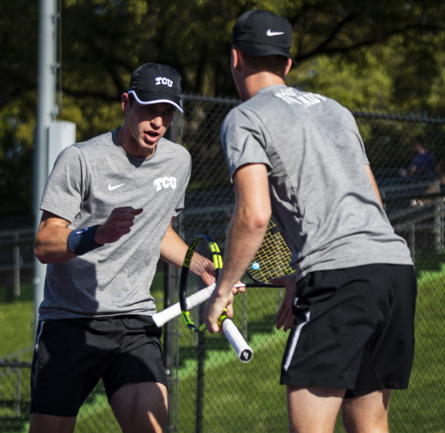 Alex Rybakov and Alastair Gray celebrate a point victory against Texas A&M on April 8, 2019. Photo by Jack Wallace