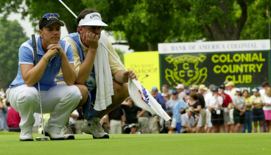 Golfer Annika Sorenstam and her caddie Terry McNamara wear long faces as they wait for Sorenstams turn to putt on the 10th hole during the second round of the Colonial golf tournament at the Colonial Country Club in Fort Worth, Texas on Friday, May 23, 2003.  Sorenstam bogied the hole. (AP Photo/David J. Phillip)