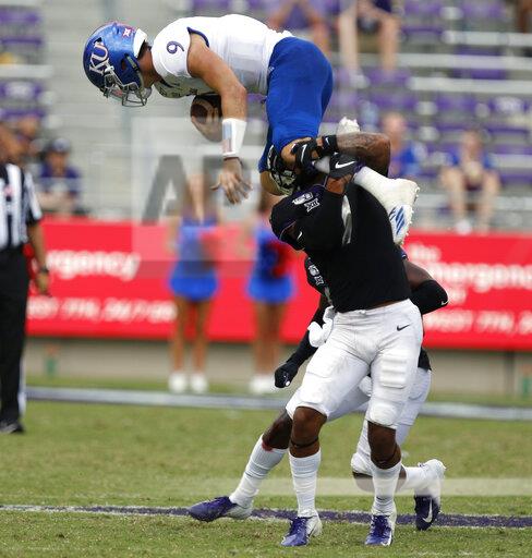 Kansas Jayhawks quarterback Carter Stanley (9) tries to leap over TCU Horned Frogs safety Trevon Moehrig (7) in the fourth quarter. The Kansas Jayhawks played the TCU Horned Frogs at Amon Carter Stadium in Fort Worth, Texas Saturday, Sept. 28, 2019.