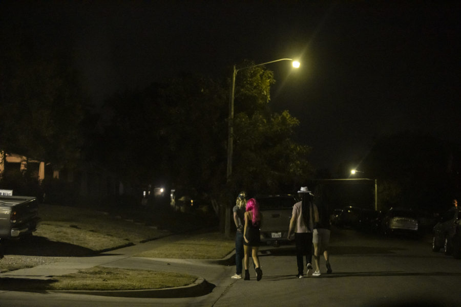 A group of students walking to a house party in the 3100 block of Merida Avenue. Photo by Heesoo Yang. 