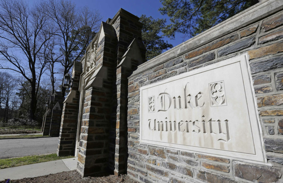 File-This Jan. 28, 2019 file photo shows the entrance to the main Duke University campus in Durham, N.C. Duke University will pay $112 million to settle a whistleblower lawsuit after federal prosecutors said a research technicians fake data landed millions of dollars in federal grants, the school and the government said Monday, March 25, 2019. The private university in Durham submitted claims for dozens of research grants that contained falsified or fabricated information that unjustly drained taxpayer money from the National Institutes of Health, the Environmental Protection Agency and other federal agencies, the U.S. Justice Department said. The school said it is repaying grant money and related penalties.  (AP Photo/Gerry Broome, File)