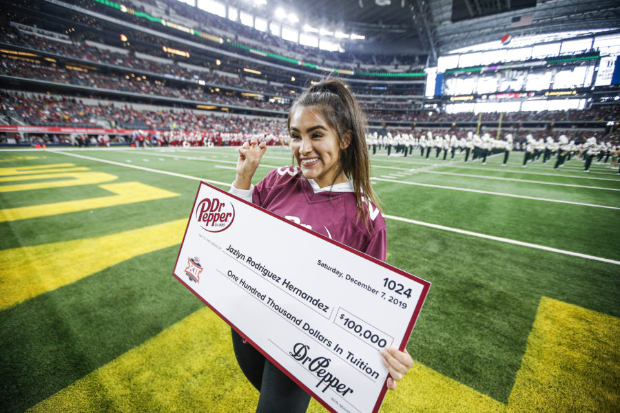 Jazlyn Rodriguez Hernandez wins $100,000 at Big 12 Championship thanks to Dr Pepper Tuition Giveaway Saturday, Dec. 7, 2019 in Arlington, Texas. ( Brandon Wade/AP Images for Dr Pepper)