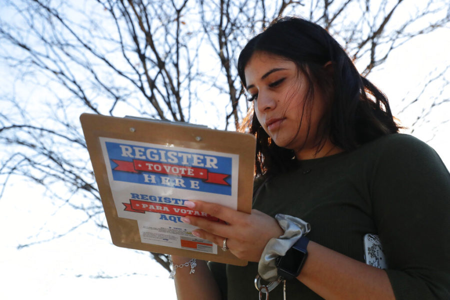 Karina+Shumate%2C+21%2C+a+college+student+studying+stenography%2C+fills+out+a+voter+registration+form+in+Richardson%2C+Texas%2C+Saturday%2C+Jan.+18%2C+2020.+Democrats+are+hoping+this+is+the+year+they+can+finally+make+political+headway+in+Texas+and+have+set+their+sights+on+trying+to+win+a+majority+in+one+house+of+the+state+Legislature.+Among+the+hurdles+theyll+have+to+overcome+are+a+series+of+voting+restrictions+Texas+Republicans+have+implemented+in+recent+years%2C+including+the+nations+toughest+voter+ID+law%2C+purging+of+voter+rolls+and+reductions+in+polling+places.+%28AP+Photo%2FLM+Otero%29