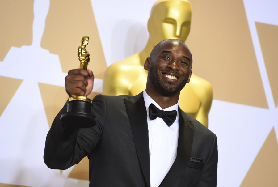 FILE - This March 4, 2018 file photo shows Kobe Bryant, winner of the award for best animated short for Dear Basketball,  at the Oscars in Los Angeles. Bryant, a five-time NBA champion and a two-time Olympic gold medalist, died in a helicopter crash in California on Sunday, Jan. 26, 2020. He was 41. (Photo by Jordan Strauss/Invision/AP, File)