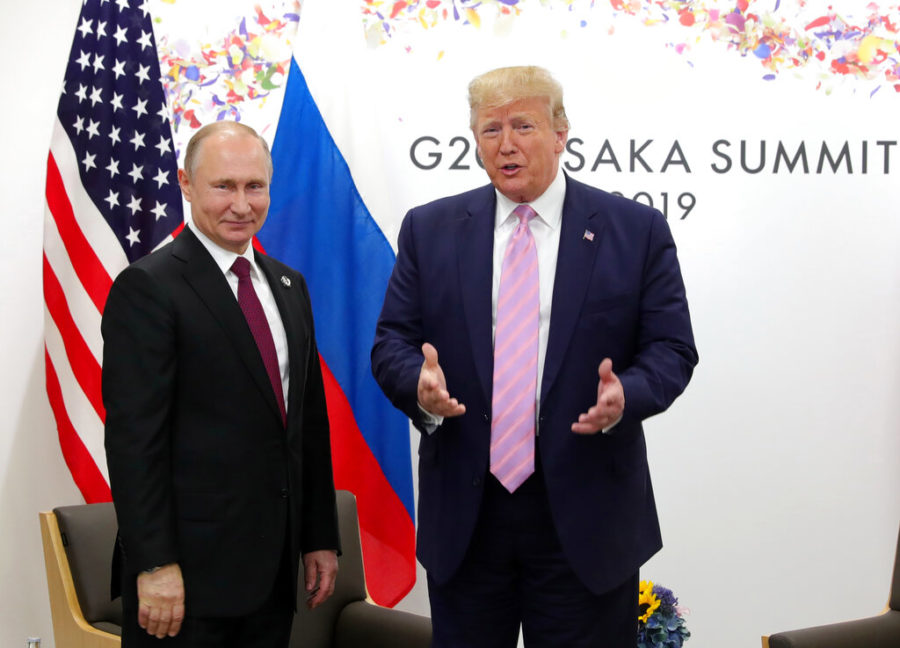 U.S. President Donald Trump, right, and Russian President Vladimir Putin pose for a photo during a bilateral meeting on the sidelines of the G-20 summit in Osaka, Japan, Friday, June 28, 2019. (Mikhail Klimentyev, Sputnik, Kremlin Pool Photo via AP)