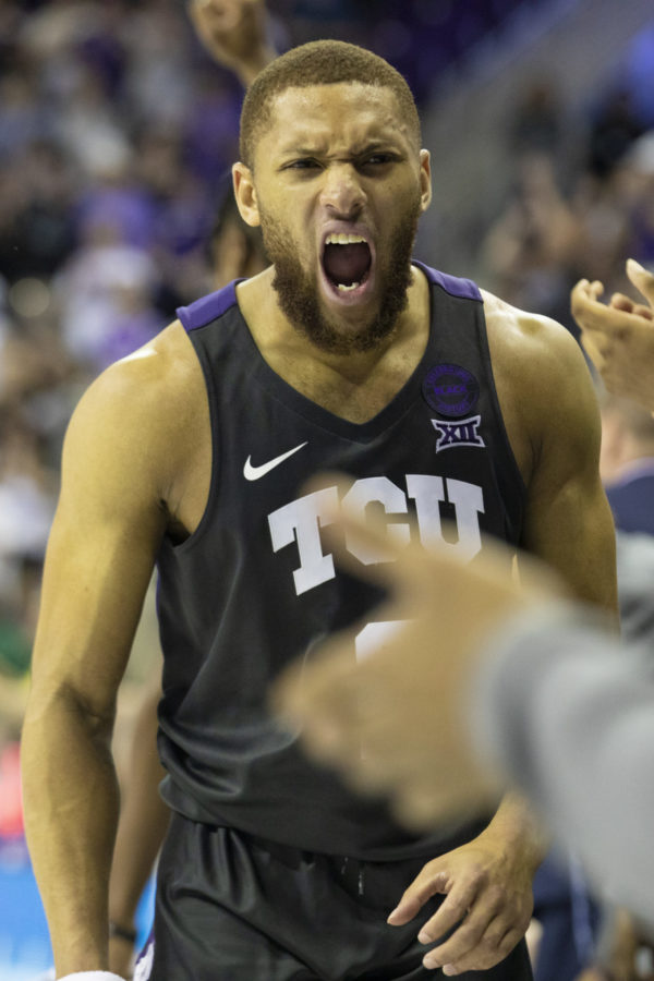 Edric Dennis Jr. (2) celebrates on the bench as the Frogs take a commanding lead late in the 2nd half.
Photo by Heesoo Yang