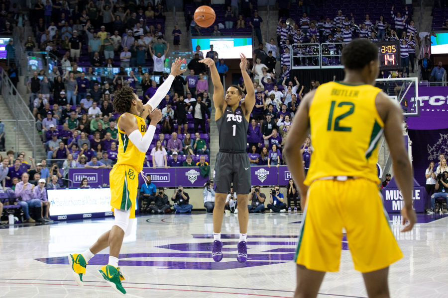 Desmond Bane (1) steps back to nail a three-pointer against No. 2 Baylor in 2020. (Heesoo Yang/Staff Photographer)