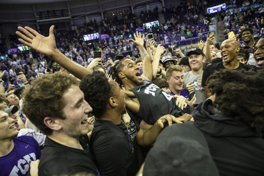 Philip Fuller (4) is crowdsurfing as students and players storm the court to celebrate beating No. 2 Baylor.
Photo by Heesoo Yang