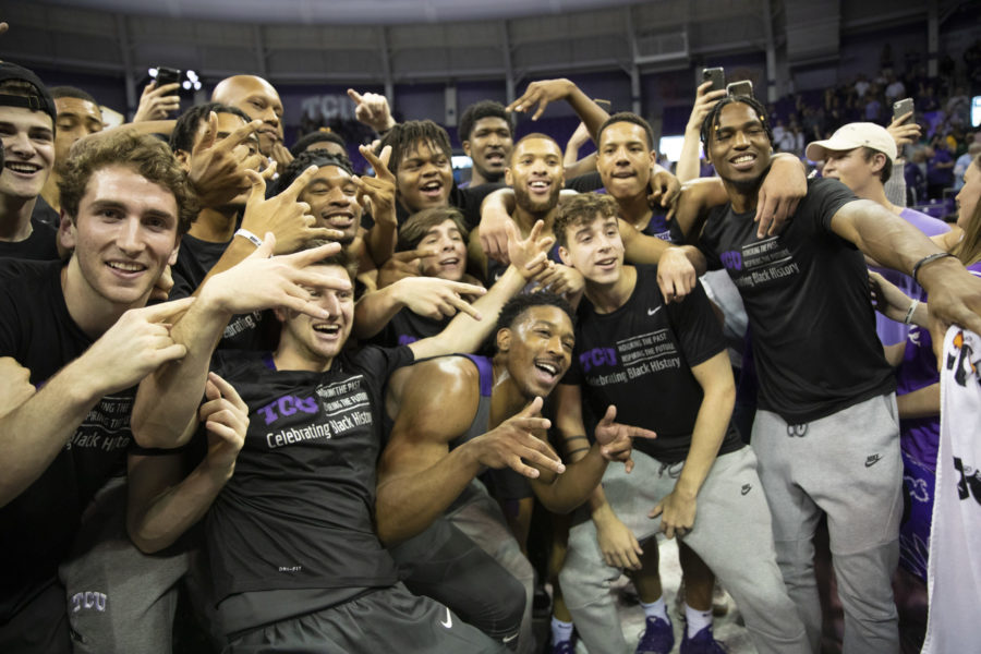 TCU players are posing for a photo after the game. 
Photo by Heesoo Yang