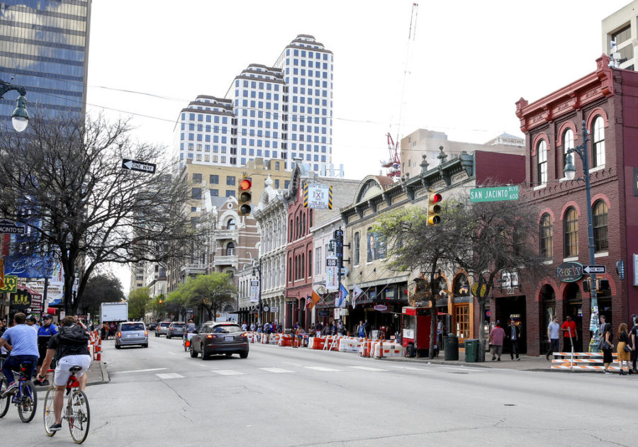 FILE - This March 12, 2016 file photo shows a general view of Sixth Street during South By Southwest in Austin, Texas. Austin city officials have canceled the South by Southwest arts and technology festival. Mayor Steve Adler announced a local disaster as a precaution because of the threat of the novel coronavirus, effectively cancelling the annual event that had been scheduled for March 13-22.  (Photo by Rich Fury/Invision/AP, File)