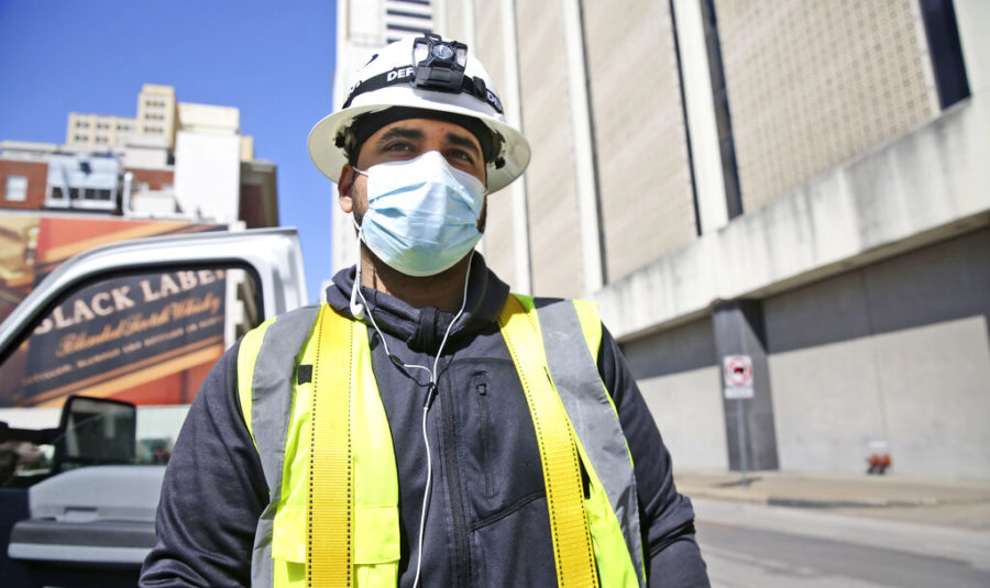 Wearing+a+mask+amid+concerns+of+the+spread+of+coronavirus%2C+City+of+Dallas+worker+Juan+Ocando+pauses+after+finishing+up+working+on+a+police+watch+camera+in+downtown+Dallas%2C+Friday%2C+April+10%2C+2020.+%28AP+Photo%2FLM+Otero%29