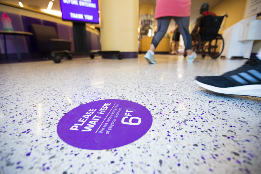 Stickers are placed every 6 feet in Market Square to promote social distancing when waiting in lines. (Heesoo Yang/Staff Photographer)