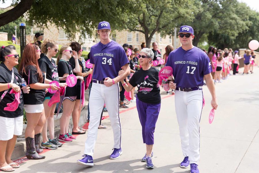 Mary Ruth Jones, a cancer survivor, is escorted by the baseball and basketball team in a survivor parade in 2015