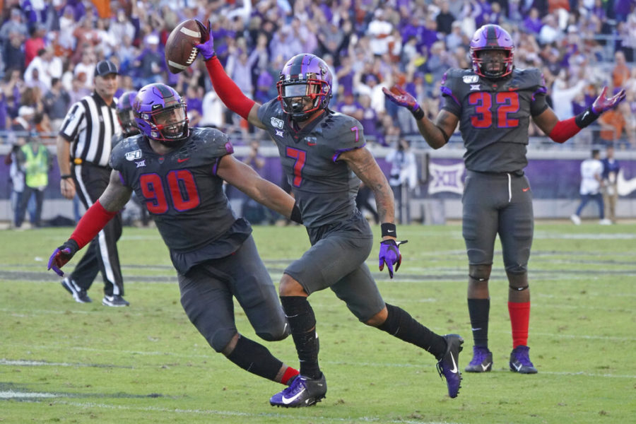 FILE - In this Oct. 26, 2019, file photo, TCU safety Trevon Moehrig (7) celebrates his interception with teammates Ross Blacklock (90) and Ochaun Mathis (32) in the second half of an NCAA college football game, in Fort Worth, Texas. Moehrig was selected to The Associated Press All-Big 12 Conference team, Friday, Dec. 13, 2019. (AP Photo/Louis DeLuca, File)