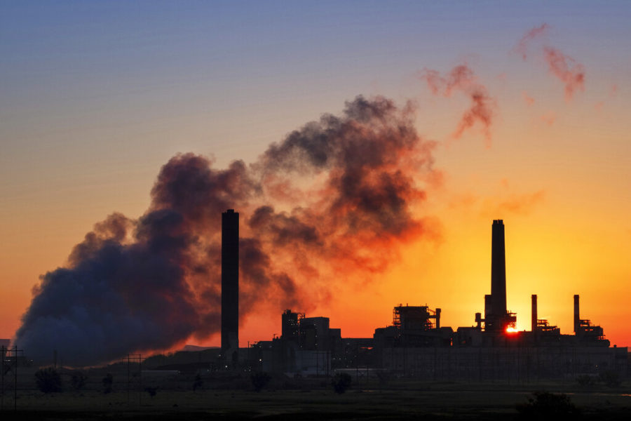 FILE - In this July 27, 2018, file photo, the Dave Johnson coal-fired power plant is silhouetted against the morning sun in Glenrock, Wyo. A record drop in U.S. energy consumption this spring was driven by less demand for coal that's burned for electricity and oil that's refined into gasoline and jet fuel. (AP Photo/J. David Ake, File)