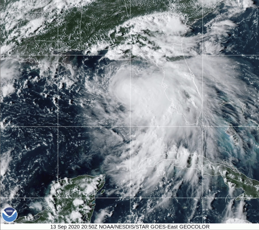 This satellite photo provided by the National Oceanic and Atmospheric Administration shows Tropical Storm Sally, Sunday, Sept. 13, 2020, at 2050 GMT. Sally churned northward on Sunday, poised to turn into a hurricane and send a life-threatening storm surge along the northern Gulf of Mexico. (NOAA via AP)
