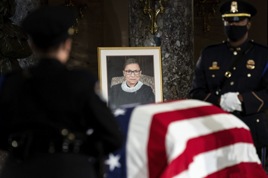 The flag-draped casket of Justice Ruth Bader Ginsburg lies in state in the U.S. Capitol on Friday, Sept. 25, 2020. Ginsburg died at the age of 87 on Sept. 18 and is the first women to lie in state at the Capitol. (Erin Schaff/The New York Times via AP, Pool)
