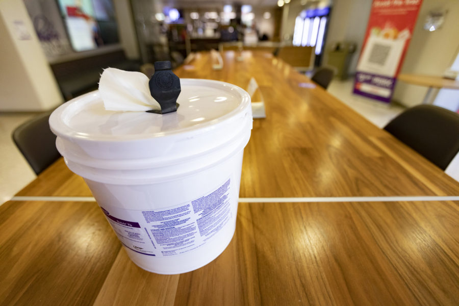 Disinfectant wipes are placed throughout the library.