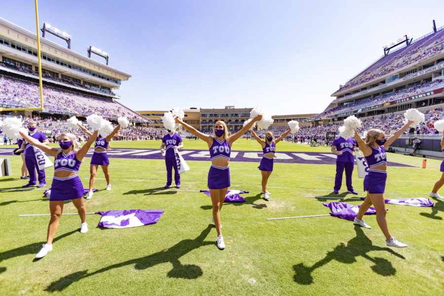TCU cheerleaders cheer six-feet apart at the football game.
