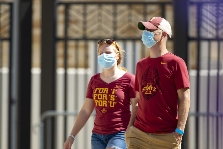 Iowa State fans walk into Amon G. Carter Stadium.