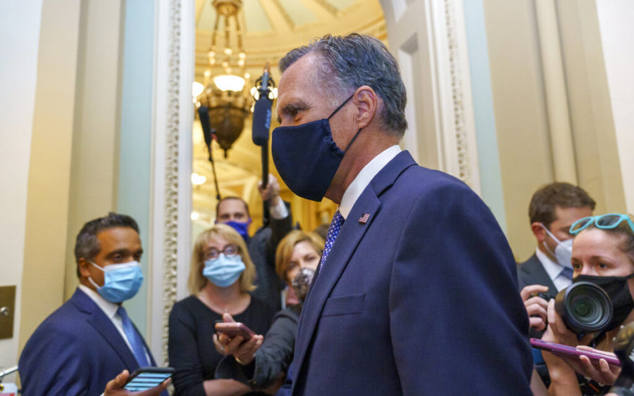 Sen. Mitt Romney, R-Utah, leaves the Senate Chamber following a vote, at the Capitol in Washington, Monday, Sept. 21, 2020. Romney is one of four Republicans who could oppose a vote on a replacement for the late Justice Ruth Bader Ginsburg prior to Election Day. (AP Photo/J. Scott Applewhite)