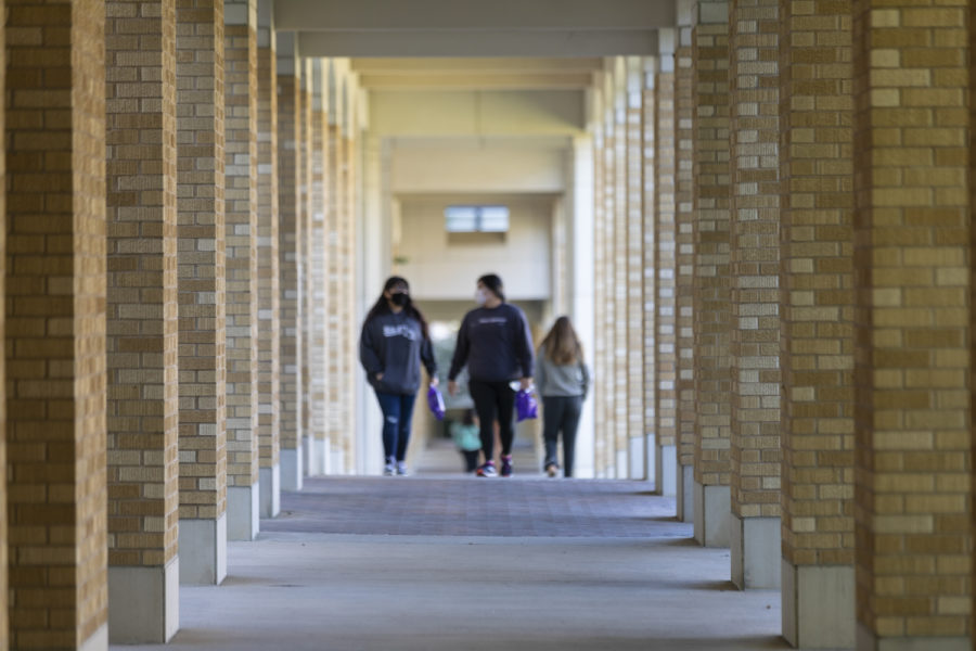 Students walk in the walkways in the Commons.