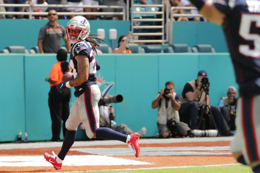 New England Patriots cornerback Stephon Gilmore (24) looks back after scoring a touchdown, during the second half at an NFL football game against the Miami Dolphins, Sunday, Sept. 15, 2019, in Miami Gardens, Fla. (AP Photo/Lynne Sladky)