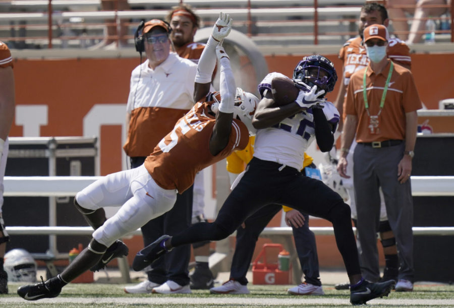 TCU wide receiver Blair Conwright (22) pulls in a pass over Texas defensive back DShawn Jamison (5) during the second half of an NCAA college football game, Saturday, Oct. 3, 2020, in Austin, Texas. (AP Photo/Eric Gay)