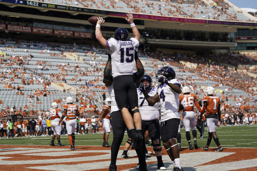 TCU quarterback Max Duggan (15) is lifted after scoring a touchdown on a run against Texas during the first half of an NCAA college football game, Saturday, Oct. 3, 2020, in Austin, Texas. (AP Photo/Eric Gay)