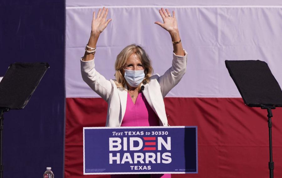 Jill Biden waves to supportes while campaigning for her husband and former Vice President Joe Biden at Fair Park Tuesday, Oct. 13, 2020, in Dallas. (AP Photo/LM Otero)