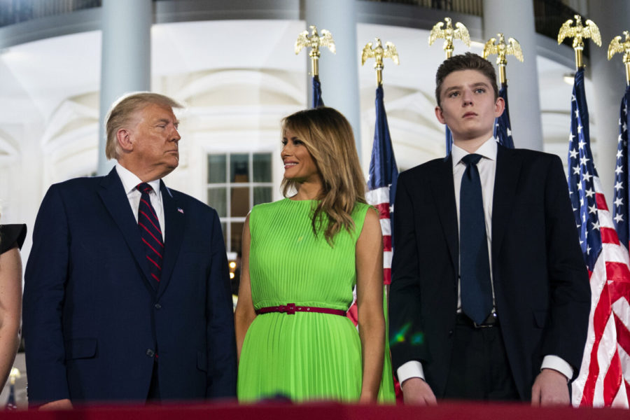 In this Aug. 27, 2020 file photo, Barron Trump right, stands with President Donald Trump and  first lady Melania Trump on the South Lawn of the White House on the fourth day of the Republican National Convention in Washington. (AP Photo/Evan Vucci)