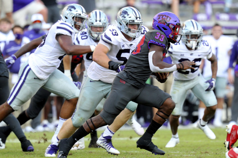 TCU running back Kendre Miller (33) carries the ball against Kansas State in an NCAA college football game Saturday, Oct. 10, 2020, in Fort Worth, Texas. (AP Photo/Richard W. Rodriguez)
