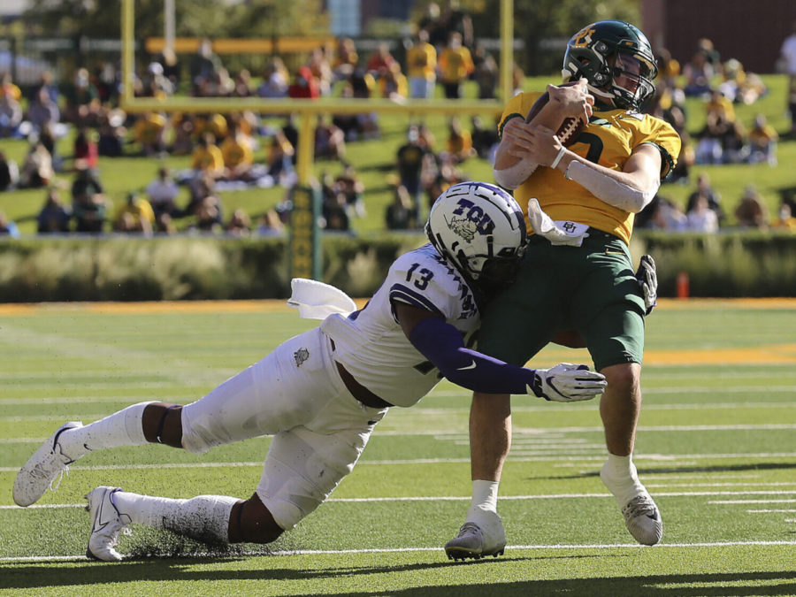 Baylor quarterback Charlie Brewer (5) is tackled by TCU linebacker Dee Winters (13) during the first half of an NCAA college football game in Waco, Texas, Saturday, Oct. 31, 2020. (Jerry Larson/Waco Tribune-Herald via AP)