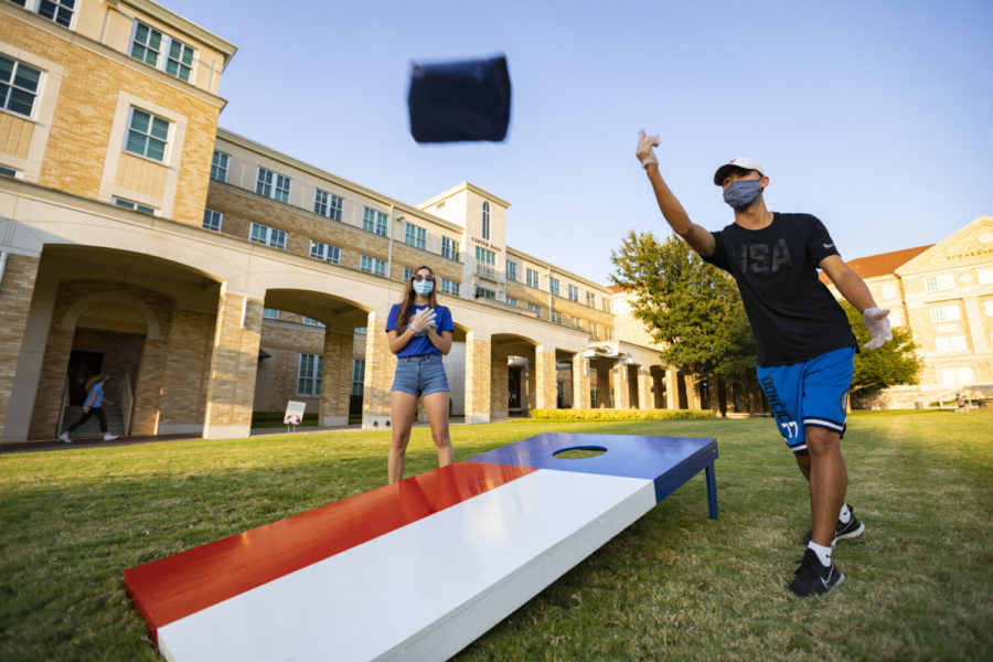 Students play corn hole in the Commons.
