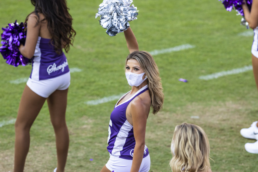 A TCU Showgirl cheers from the sidelines.