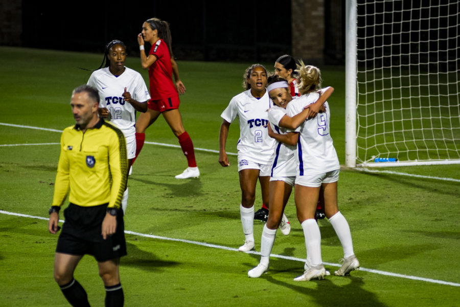 Gracie Collins celebrates with her teammates after extending the TCU lead to 2-0 against Texas Tech.
