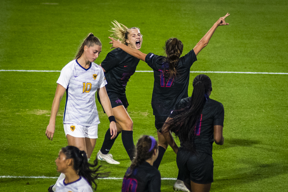 Grace Collins celebrates with Gracie Brian (right) after Collins' goal.