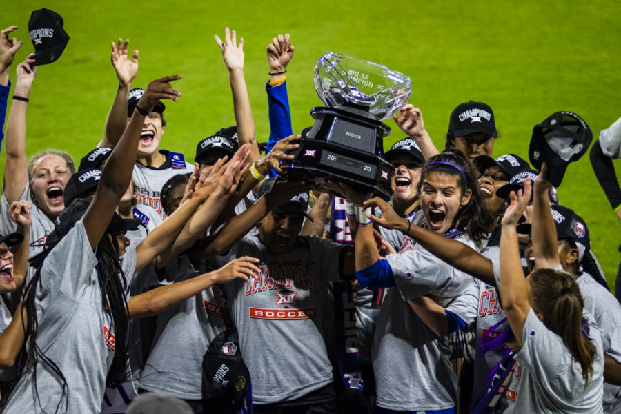 The TCU women's soccer team hoists the Big 12 title trophy after defeating West Virginia 1-0.