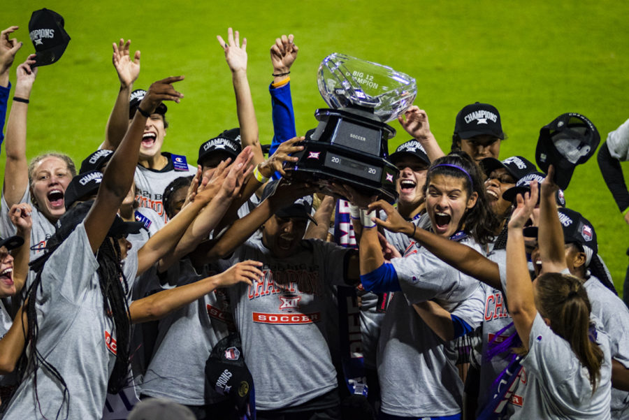 The TCU womens soccer team hoists the Big 12 title trophy after defeating West Virginia 1-0. (Jack Wallace/Staff Photographer)