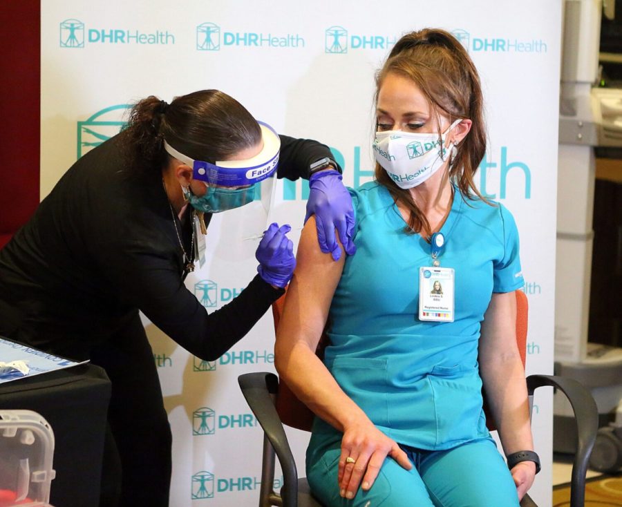 Nurse Lindsie Schuster, RN, is the first in line to receive the COVID-19 vaccine from pharmacist Annette Ozuna as DHR Health administers their first batch of the COVID-19 vaccines at the Edinburg Conference Center at Renaissance on Wednesday, Dec. 16, 2020, in Edinburg, Texas. (Photo: AP Newsroom)
