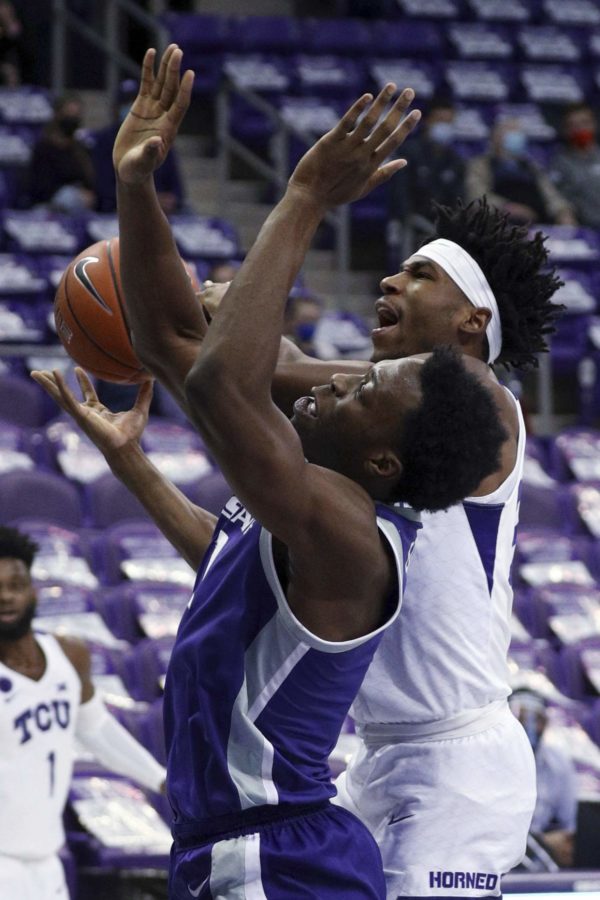 Kansas+State+forward+Kaosi+Ezeagu+%281%29+defends+against+a+shot+by+TCU+guard+RJ+Nembhard+%2822%29+during+the+first+half+of+an+NCAA+college+basketball+game+Saturday%2C+Feb.+20%2C+2021%2C+in+Fort+Worth%2C+Texas.+%28AP+Photo%2FRichard+W.+Rodriguez%29