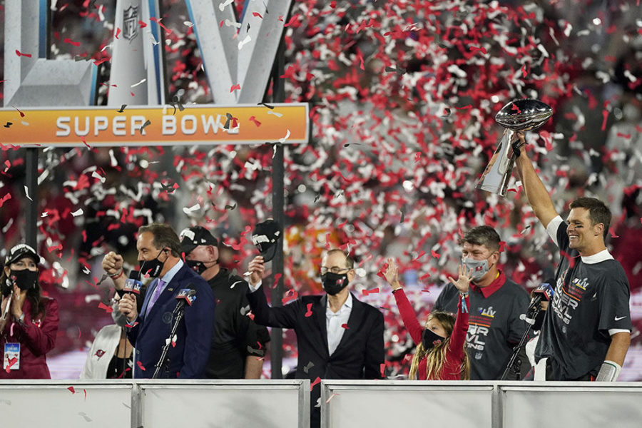 Tampa Bay Buccaneers quarterback Tom Brady celebrates with the Lombardi Trophy after defeating the Kansas City Chiefs in the NFL Super Bowl 55 football game, Sunday, Feb. 7, 2021 in Tampa, Fla. The Buccaneers defeated the Chiefs 31-9. (AP Photo/Doug Benc)