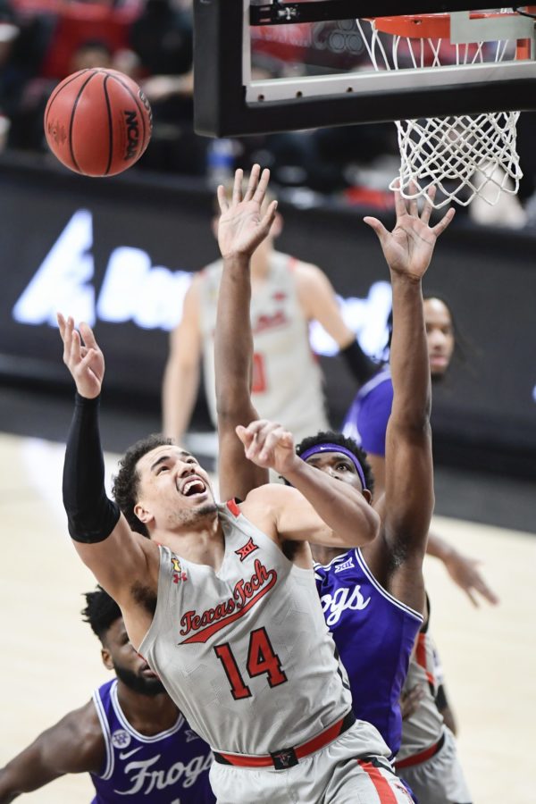 Texas Techs Marcus Santos-Silva (14) shoots during the first half of the teams NCAA college basketball game against TCU in Lubbock, Texas, Tuesday, March 2, 2021. (AP Photo/Justin Rex)