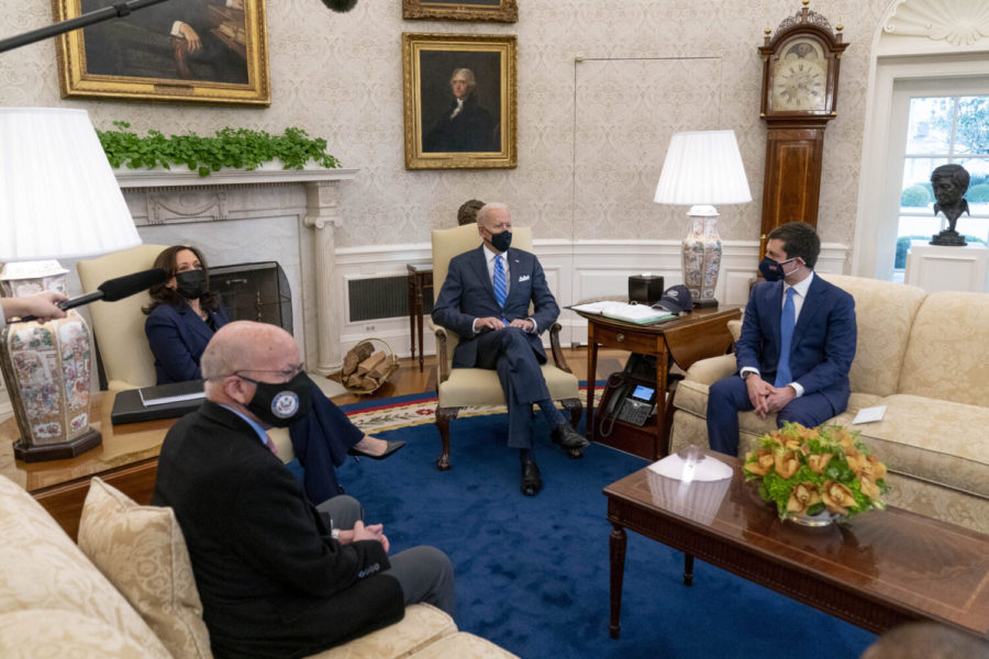 President Joe Biden, Vice President Kamala Harris, and Transportation Secretary Pete Buttigieg, meet with members of the House of Representatives in the Oval Office of the White House in Washington, Thursday, March 4, 2021, on infrastructure. Also pictured is House Transportation and Infrastructure Committee Chairman Rep. Peter DeFazio Ore., second from left. (AP Photo/Andrew Harnik)