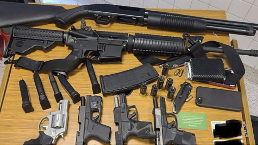 This photo provided by the Atlanta Police Department shows weapons Rico Marley was armed with at the time of his arrest on Wednesday, March 24, 2021.  Authorities say Marley, who walked into an Atlanta grocery store with multiple guns and body armor, was spotted by a witness who immediately became suspicious and alerted management. (Atlanta Police Department via AP)