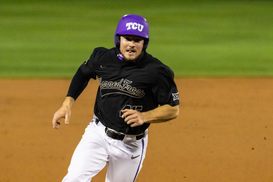 Luke Boyers runs to third base