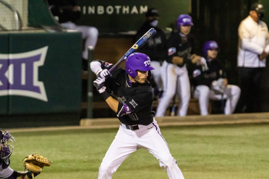 Phillip Sikes at the home plate getting ready to swing.