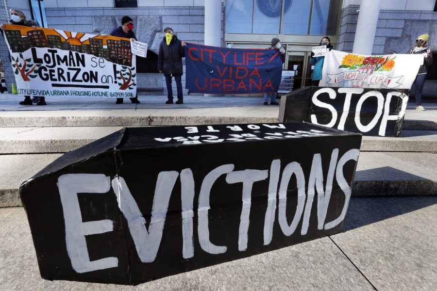 FILE - In this Jan. 13, 2021, file photo, tenants rights advocates demonstrate in front of the Edward W. Brooke Courthouse in Boston. President Joe Biden’s administration is cutting things close on a nationwide eviction moratorium, which is set to expire in less than a week. (AP Photo/Michael Dwyer, File)